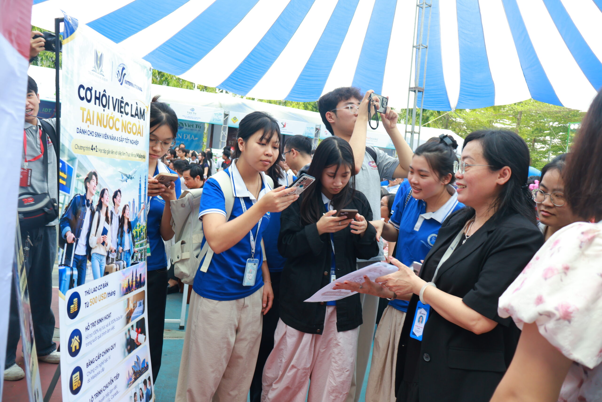 Students scan the QR code and register their interest at the V-International booth